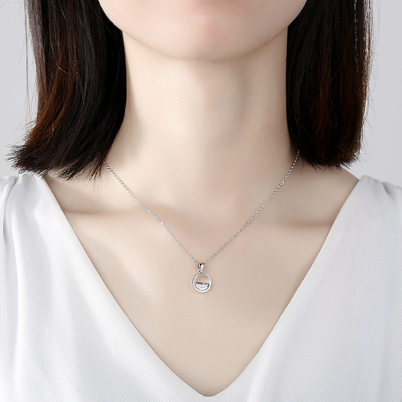 Sterling Silver Round pendant with half round Cubic Zirconia Stone on a Sterling Silver Necklace