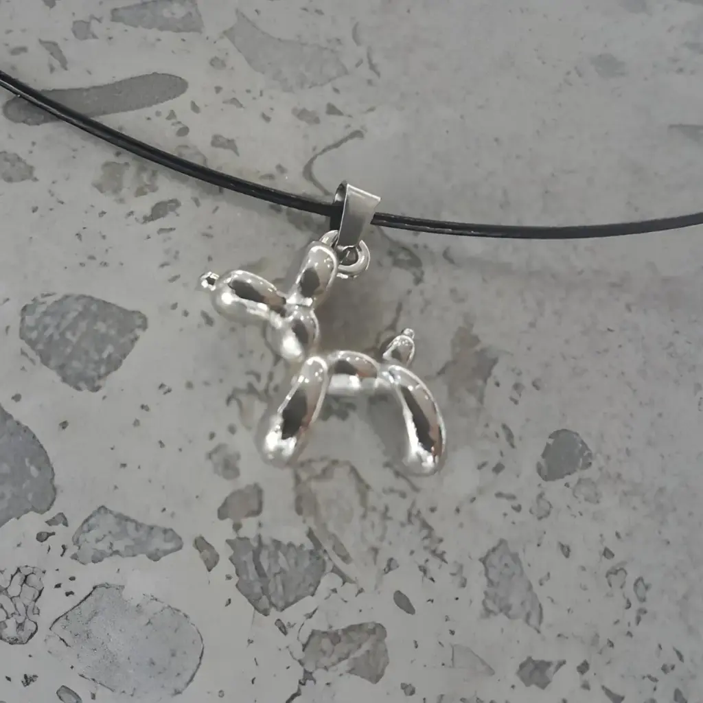 Stainless steel balloon dog pendant on black stainless steel wire necklace
